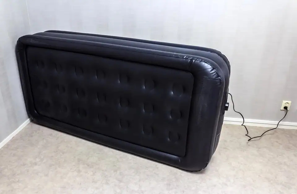 Side view of an inflated air mattress showing its height above the floor
